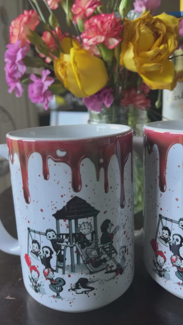 This white ceramic mug comes blood stained with our favorite Halloween villains on the playground.   Material: White ceramic mug  Dimensions: 11 and 15 oz.  Care Instructions: Mug dishwasher and microwave safe.  